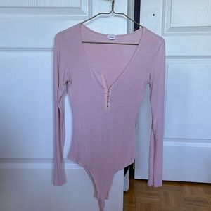 Pink body suit